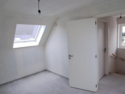 Slaapkamer onder dak met velux-dakraam